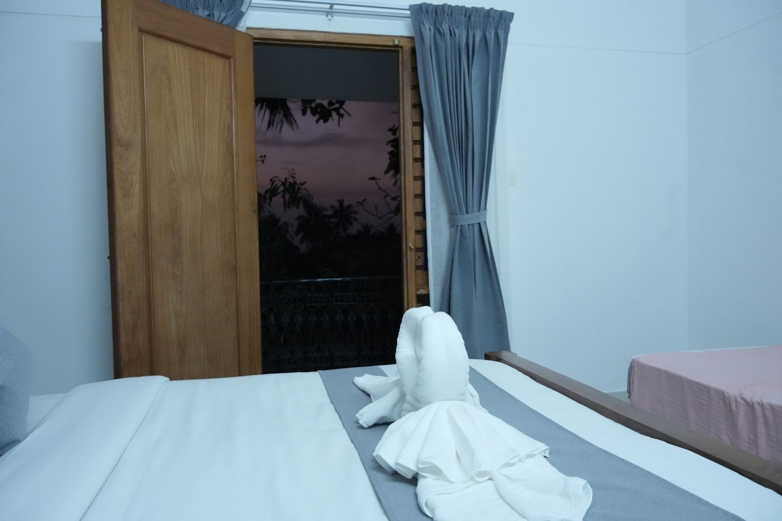 Sunset light through the balcony door of La Suite Casa