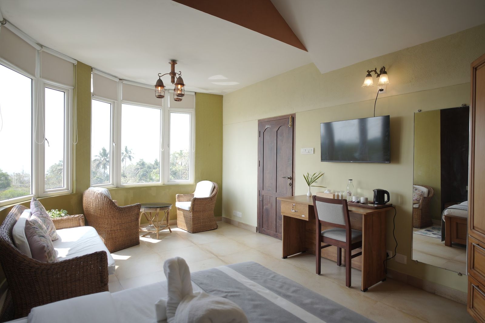 Horizon Sky Suite, the suite at The Cove, cane seating by a curve of tall windows